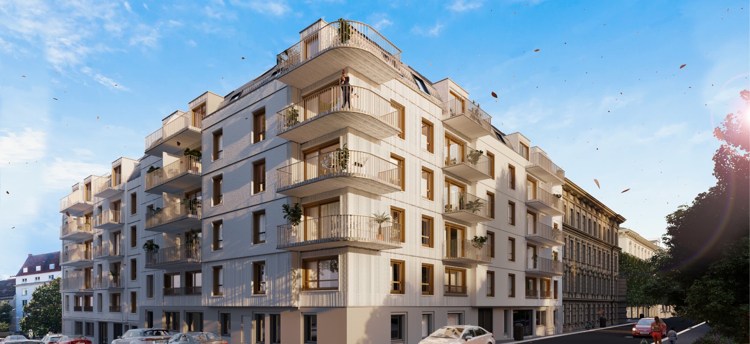 Neubau mit umlaufenden Balkonen an einer Straßenecke